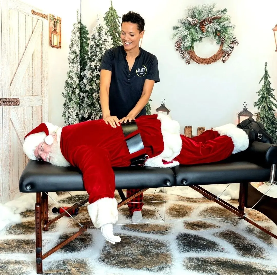 Owner Erika Lorenz giving Santa Claus a massage.