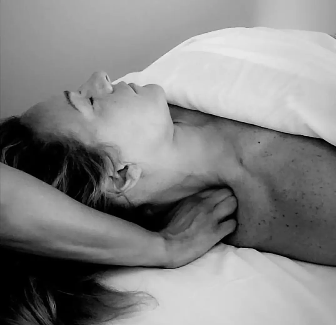 A woman being massaged.